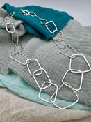 “Chain Reaction 2” Interlinking Silver Chain. image
