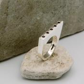 “Incline In red” Asymmetric Silver Ring with  Garnets image