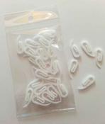 White plastic curtain hooks image