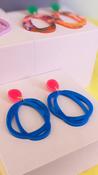 CMAT Neon Pink Top with Blue Earrings