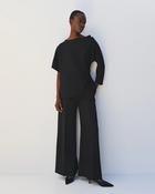 Black Top with Asymmetric Sleeve &amp;amp; Brooch on Shoulder image