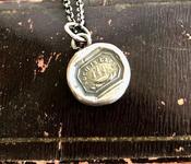 Such is life. Tiny antique wax letter seal pendant.