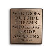 Who looks outside dreams… image